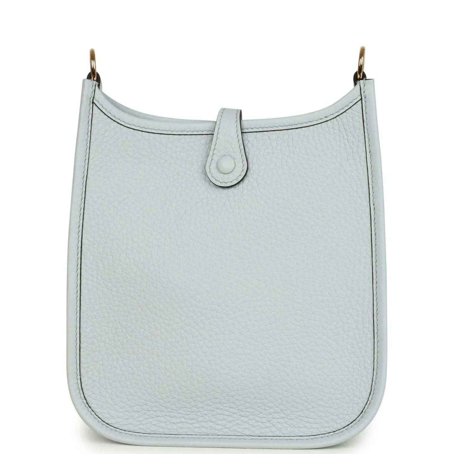 Evelyne TPM bag in pale blue grained leather with front tab and top loop handle