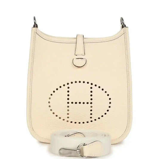 Small hobo crossbody bag in pale cream textured leather, perforated logo front
