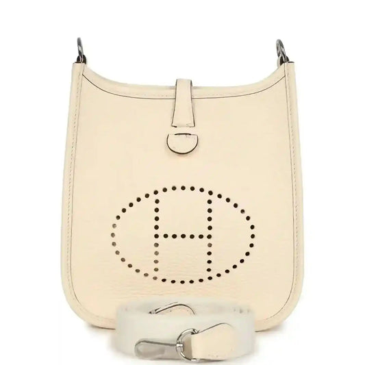 Small hobo crossbody bag in pale cream textured leather, perforated logo front