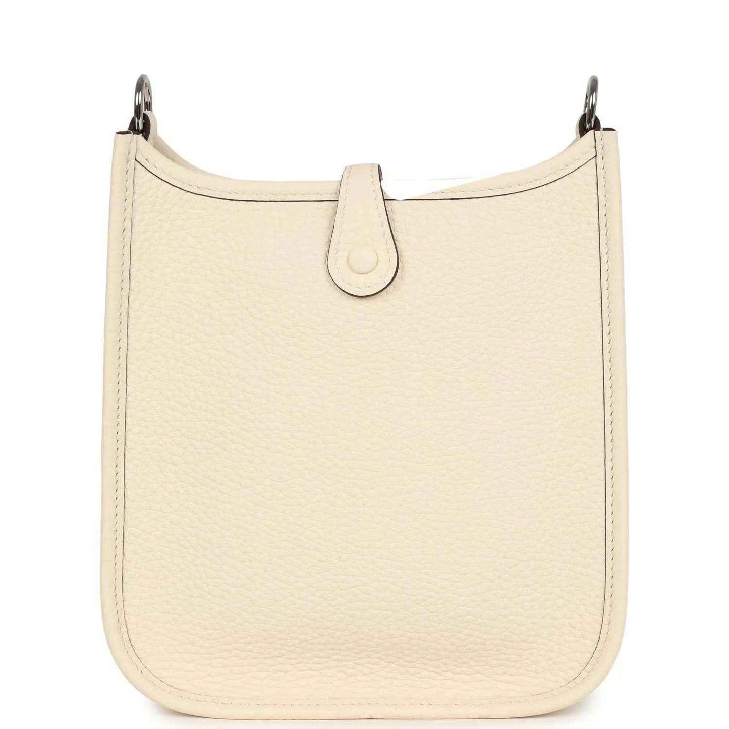 Cream textured leather bag with top loop and center strap tab