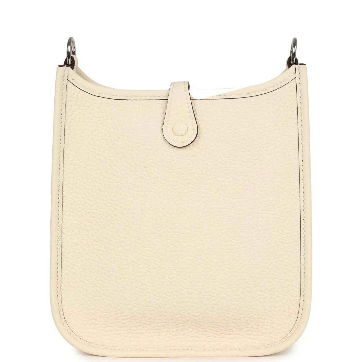 Cream textured leather bag with top loop and center strap tab