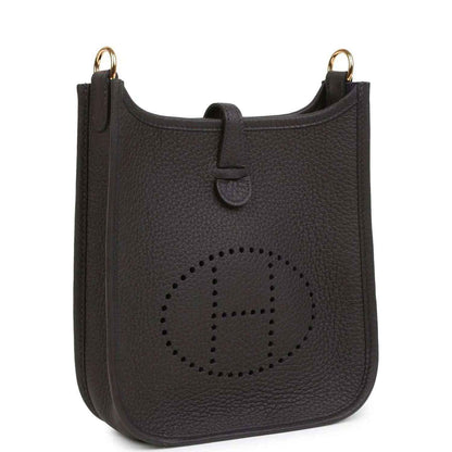 Black leather Evelyne TPM bag with perforated logo front and gold-tone top rings.