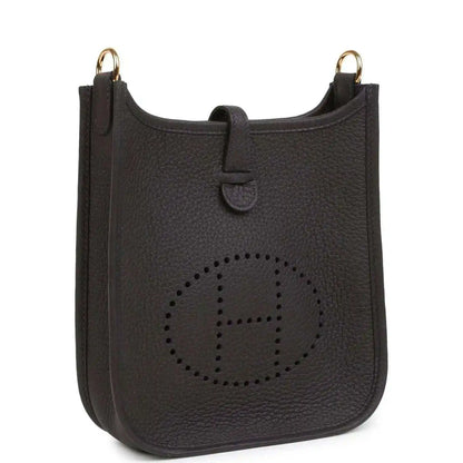 Black leather Evelyne TPM bag with perforated logo front and gold-tone top rings.