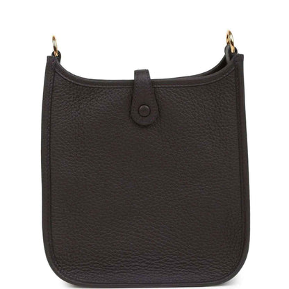 Black leather Evelyne TPM bag with center strap tab and gold-tone top ring hardware.