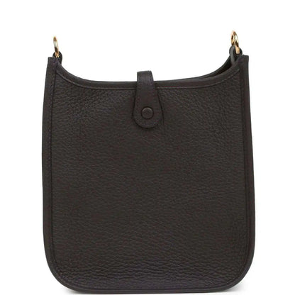 Black leather Evelyne TPM bag with center strap tab and gold-tone top ring hardware.