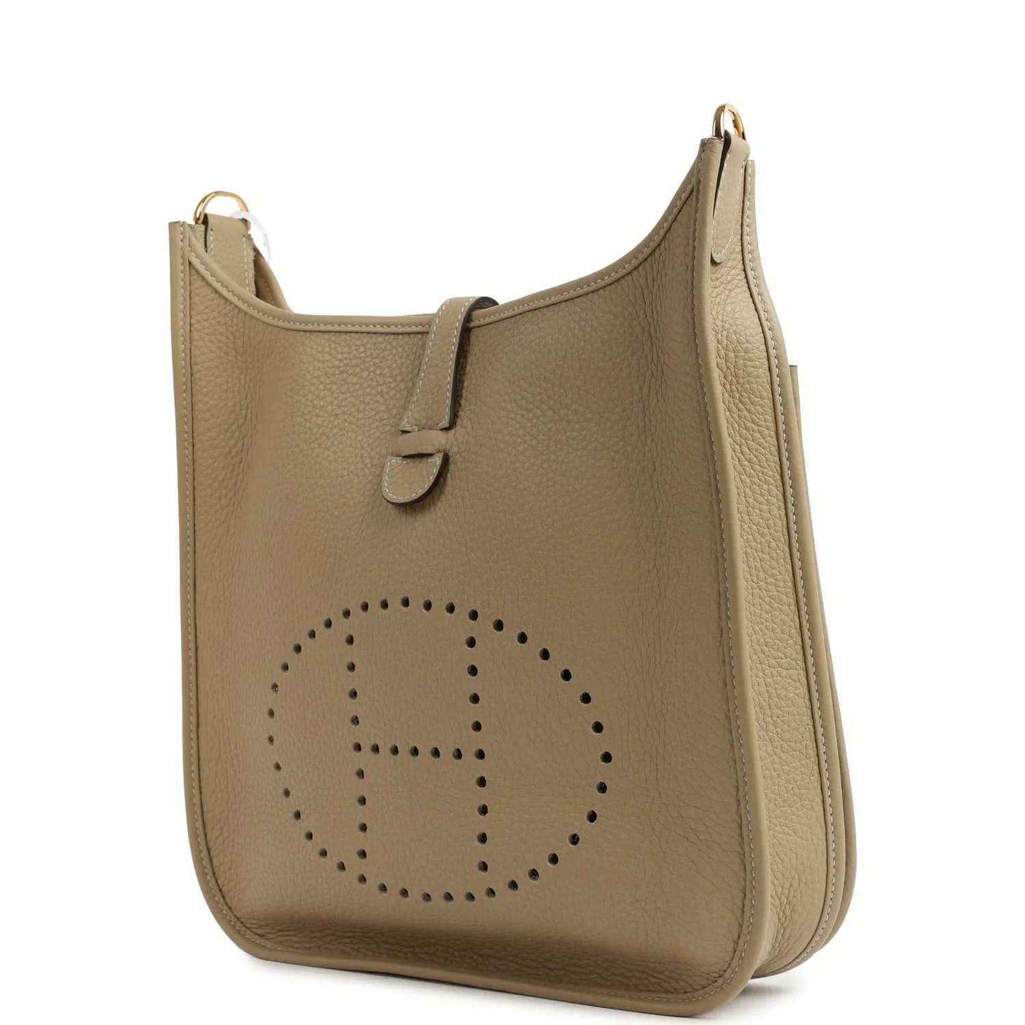Small tan leather shoulder bag with perforated logo panel and gold-toned top rings