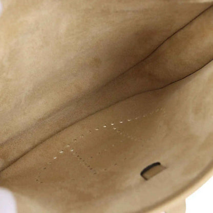 Tan leather bag interior with suede-like lining and small stitched pocket opening