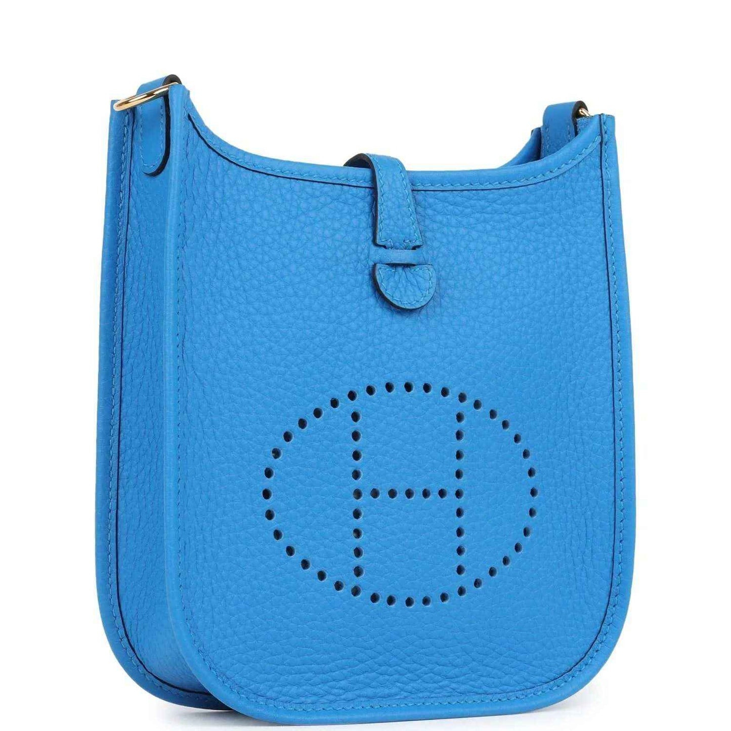 Blue leather Evelyne TPM style crossbody bag, front view with decorative stitched emblem.