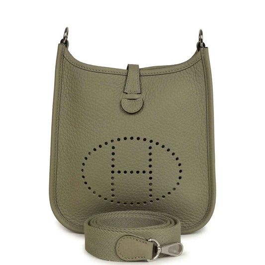 Sage green leather crossbody bag with perforated Evelyne logo and adjustable strap