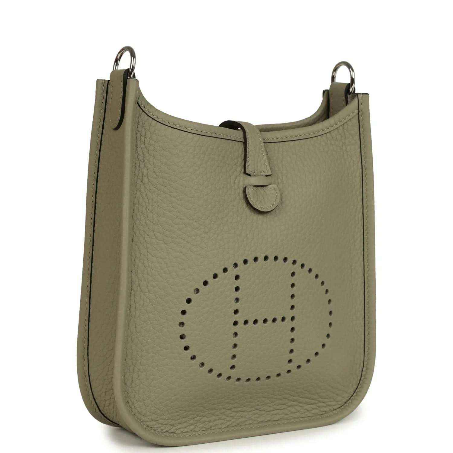 Sage green leather crossbody bag with perforated Evelyne logo and top handle