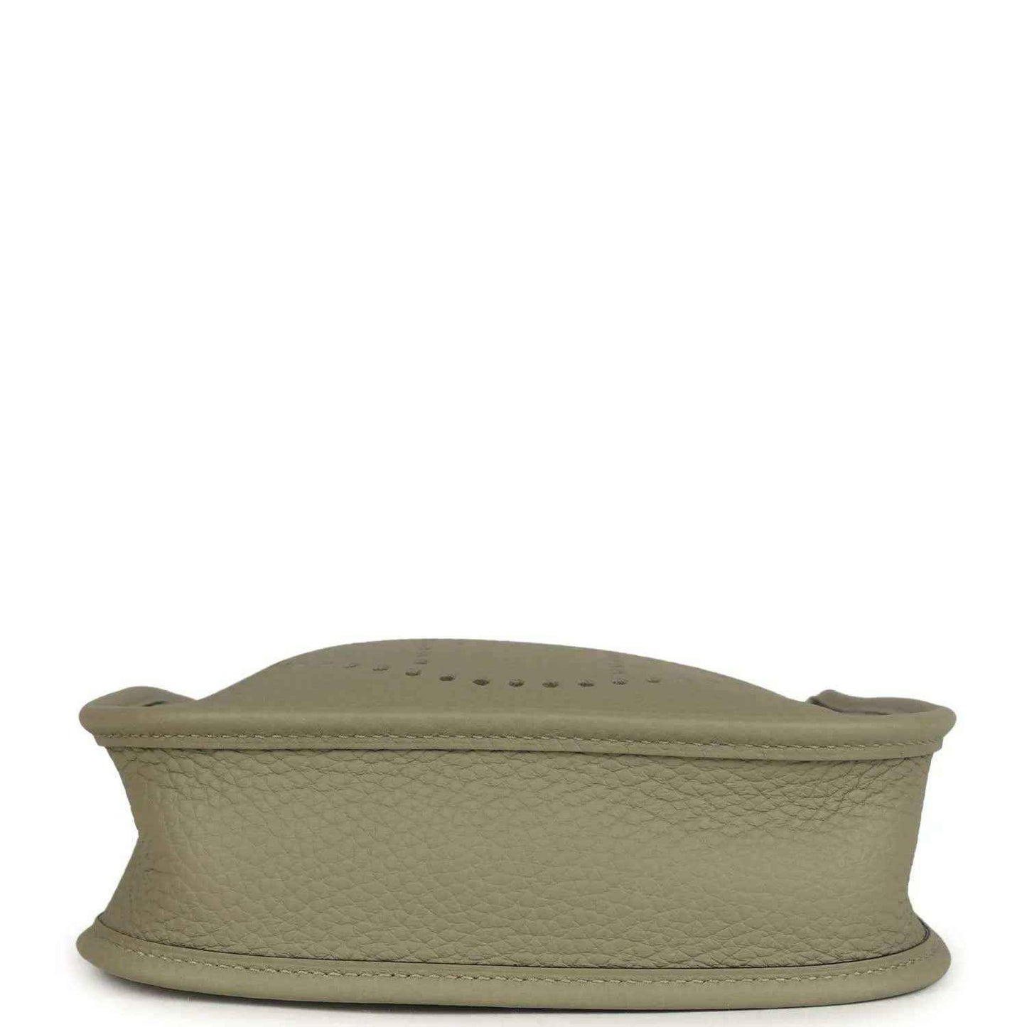 Sage green leather crossbody bag base with stitched edge and curved shape