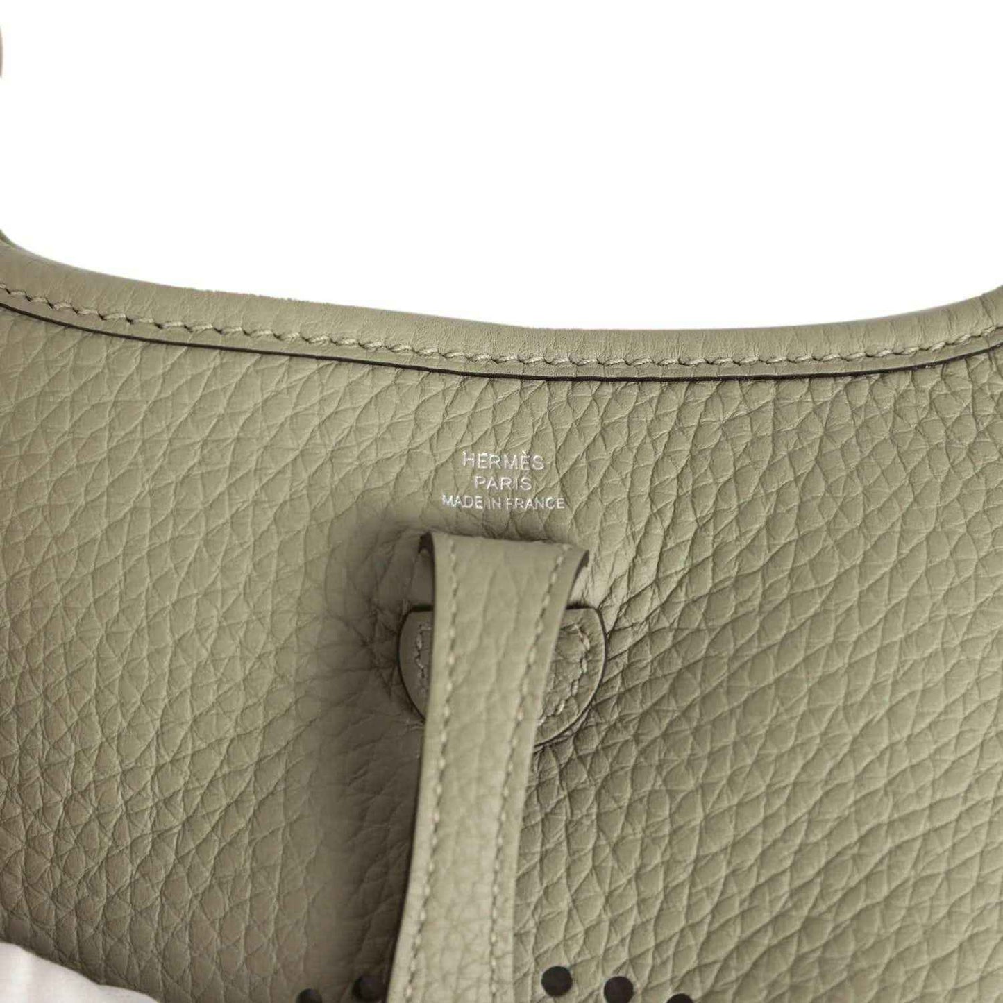 Sage green leather interior with Hermes Paris stamp and stitched tab