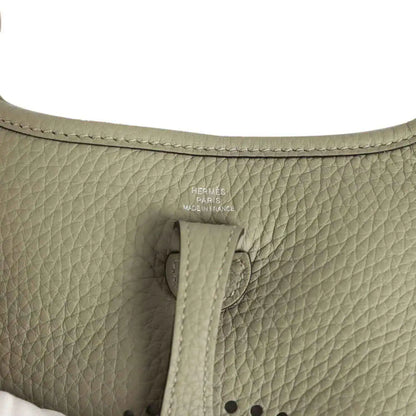 Sage green leather interior with Hermes Paris stamp and stitched tab