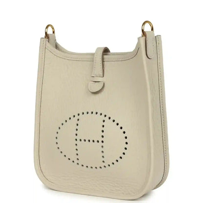 Hermes Evelyne TPM mini bag in light beige with dotted H logo and gold hardware