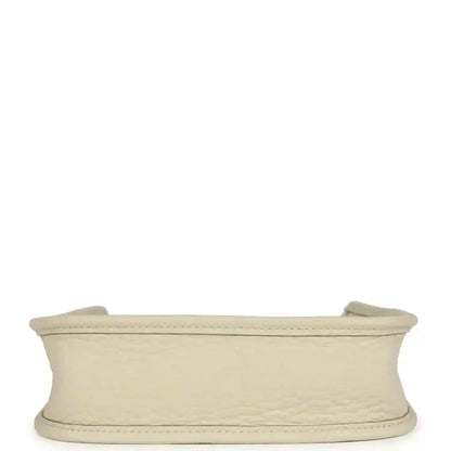 Hermes Evelyne TPM mini bag in light beige, top rim edge view