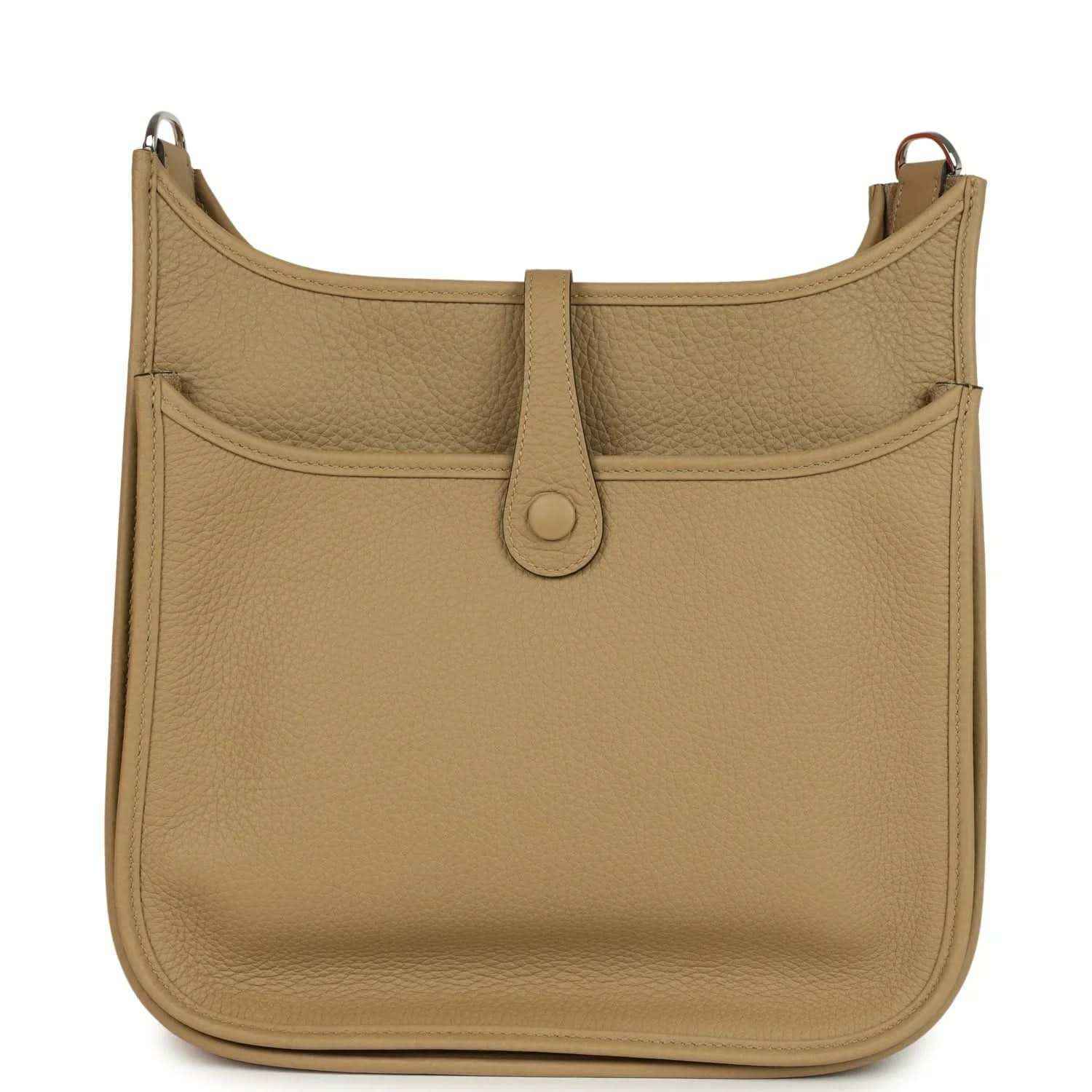 Tan leather hobo crossbody bag with front flap seam and center strap tab