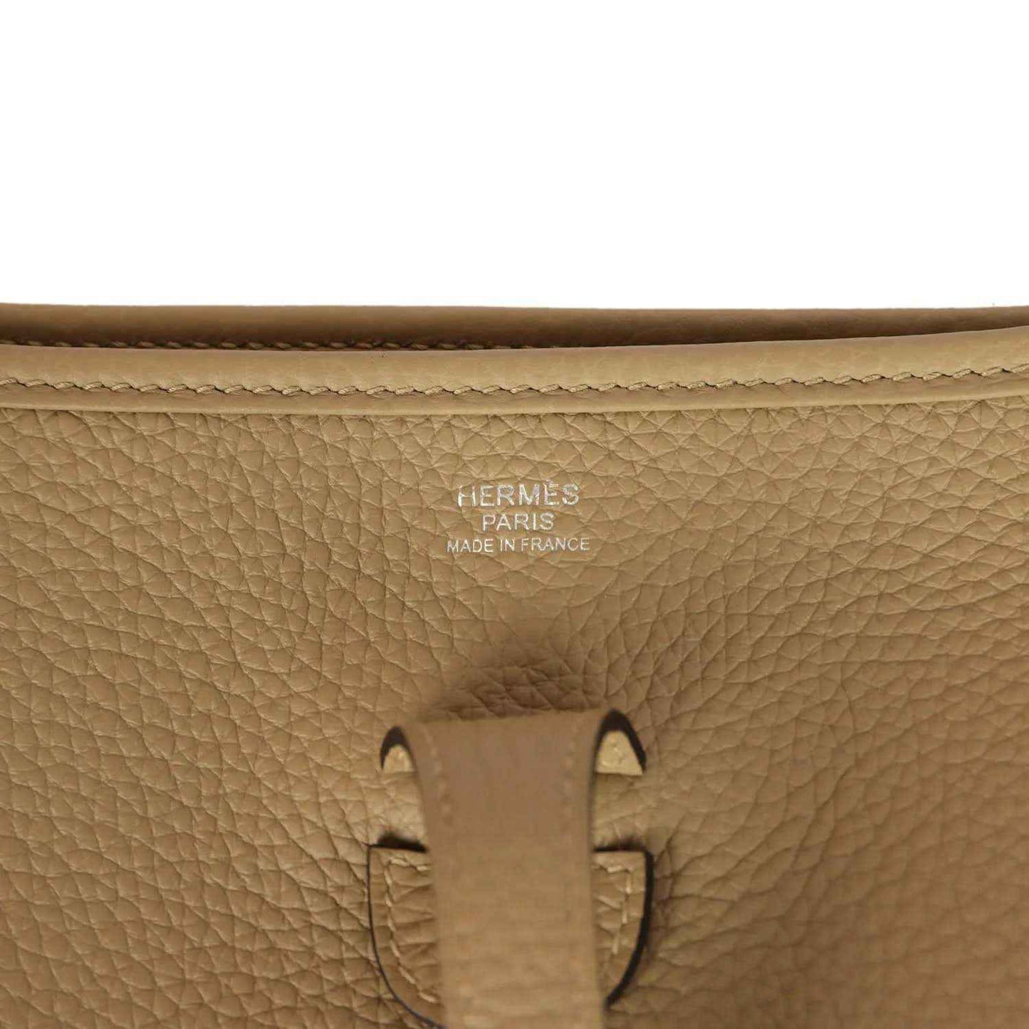 Tan leather bag stamp detail: HERMES PARIS MADE IN FRANCE