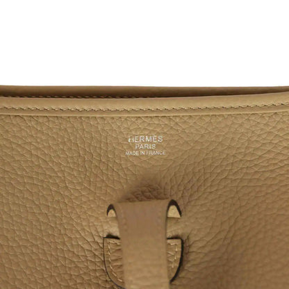 Tan leather bag stamp detail: HERMES PARIS MADE IN FRANCE