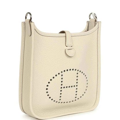 Mini leather shoulder bag in light cream with flap strap and perforated logo front