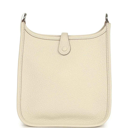 Cream leather hobo bag front with central pull-tab detail and smooth top edge