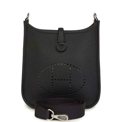 Evelyne TPM bag in dark leather with perforated logo front and adjustable strap