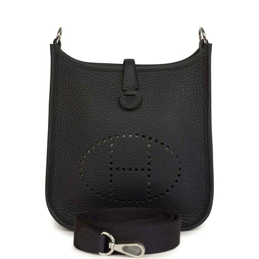 Evelyne TPM bag in dark leather with perforated logo front and adjustable strap