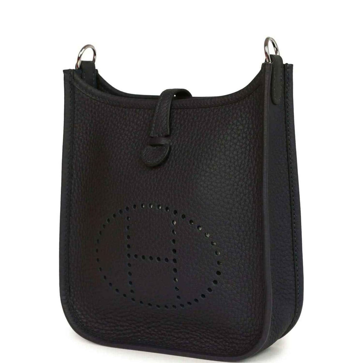 Evelyne TPM bag in dark leather with perforated logo front and metal top rings