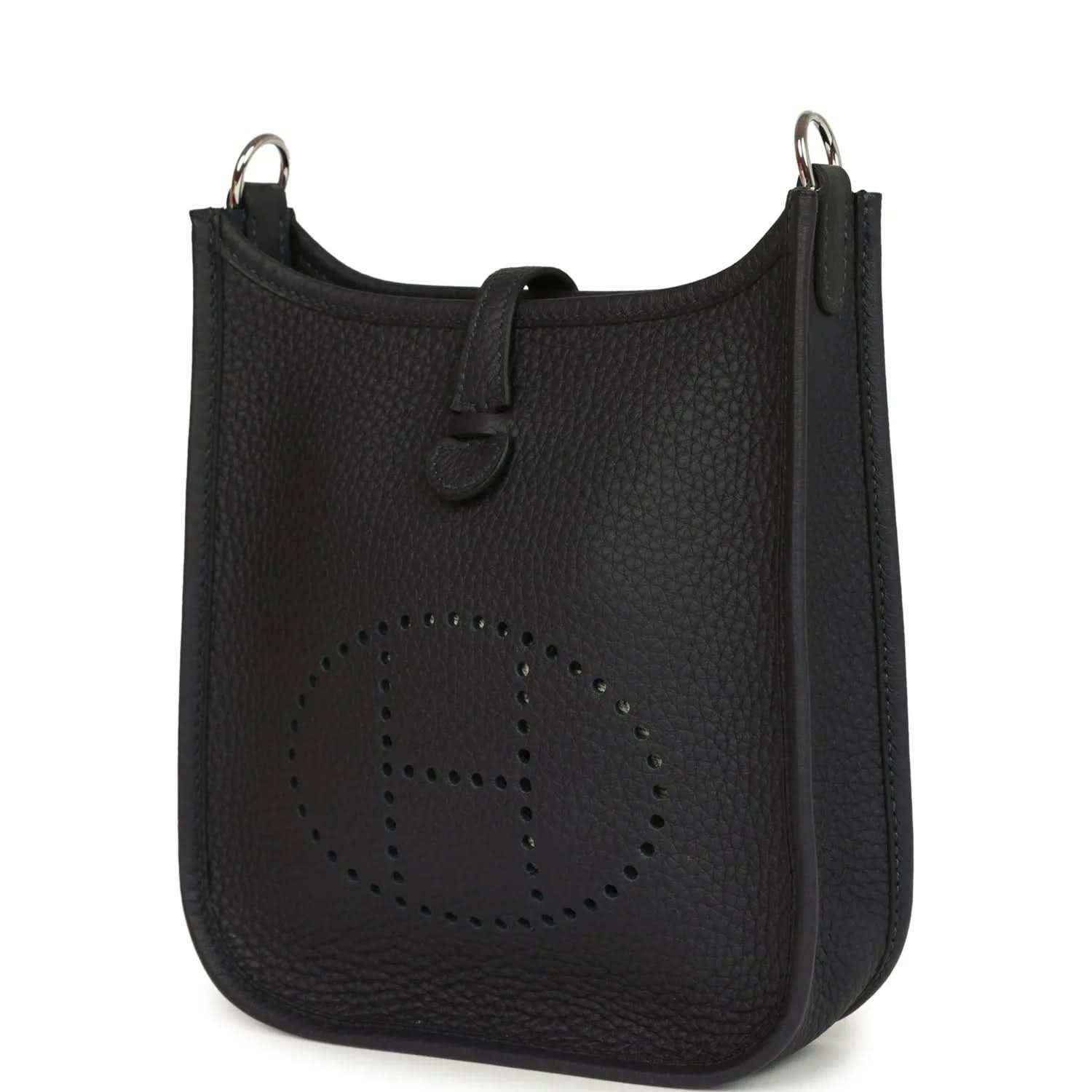 Evelyne TPM bag in dark leather with perforated logo front and metal top rings