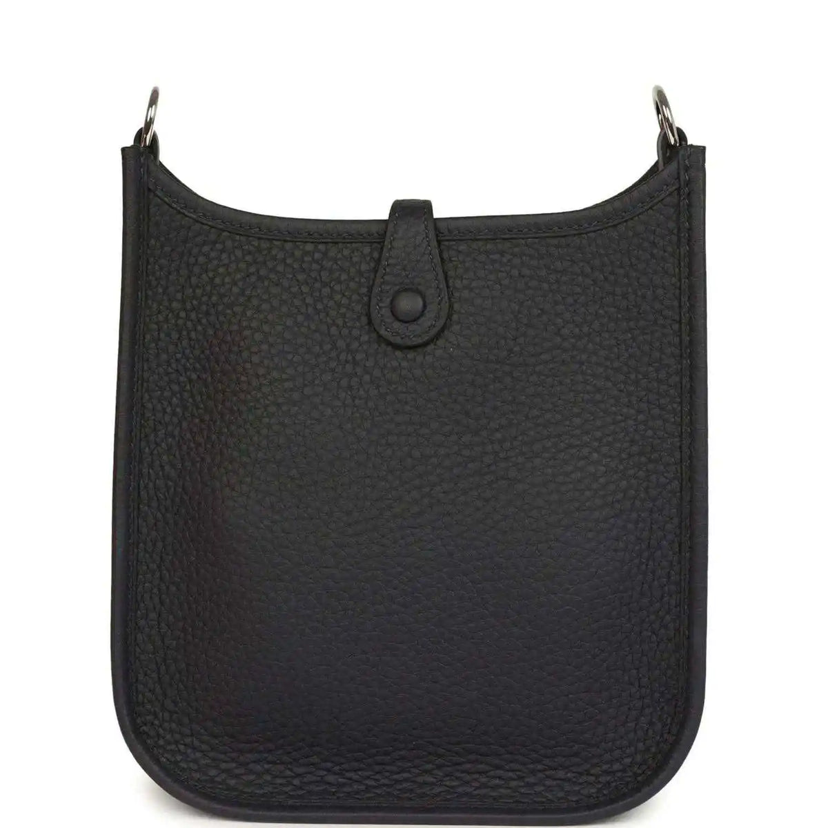 Evelyne TPM bag in dark leather with top opening and central strap tab detail