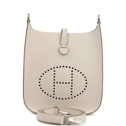 Mini shoulder bag in light beige textured leather with logo medallion and top clasp