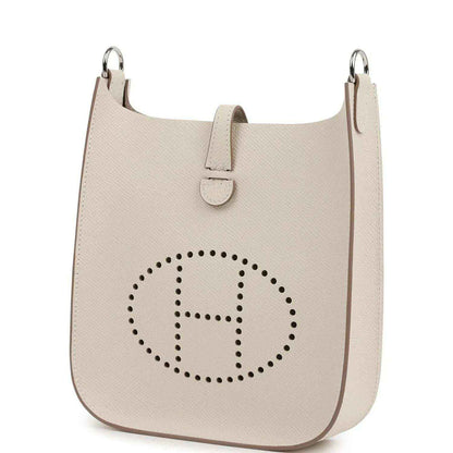 Light beige textured leather shoulder bag with logo medallion and side panel stitching