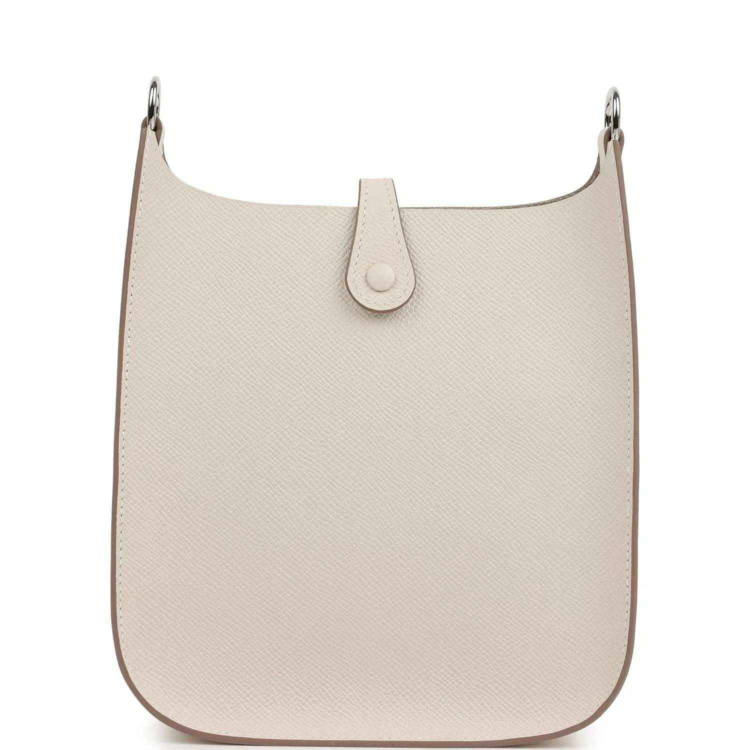 Light beige textured leather hobo-style bag with front snap tab and silver-tone rings