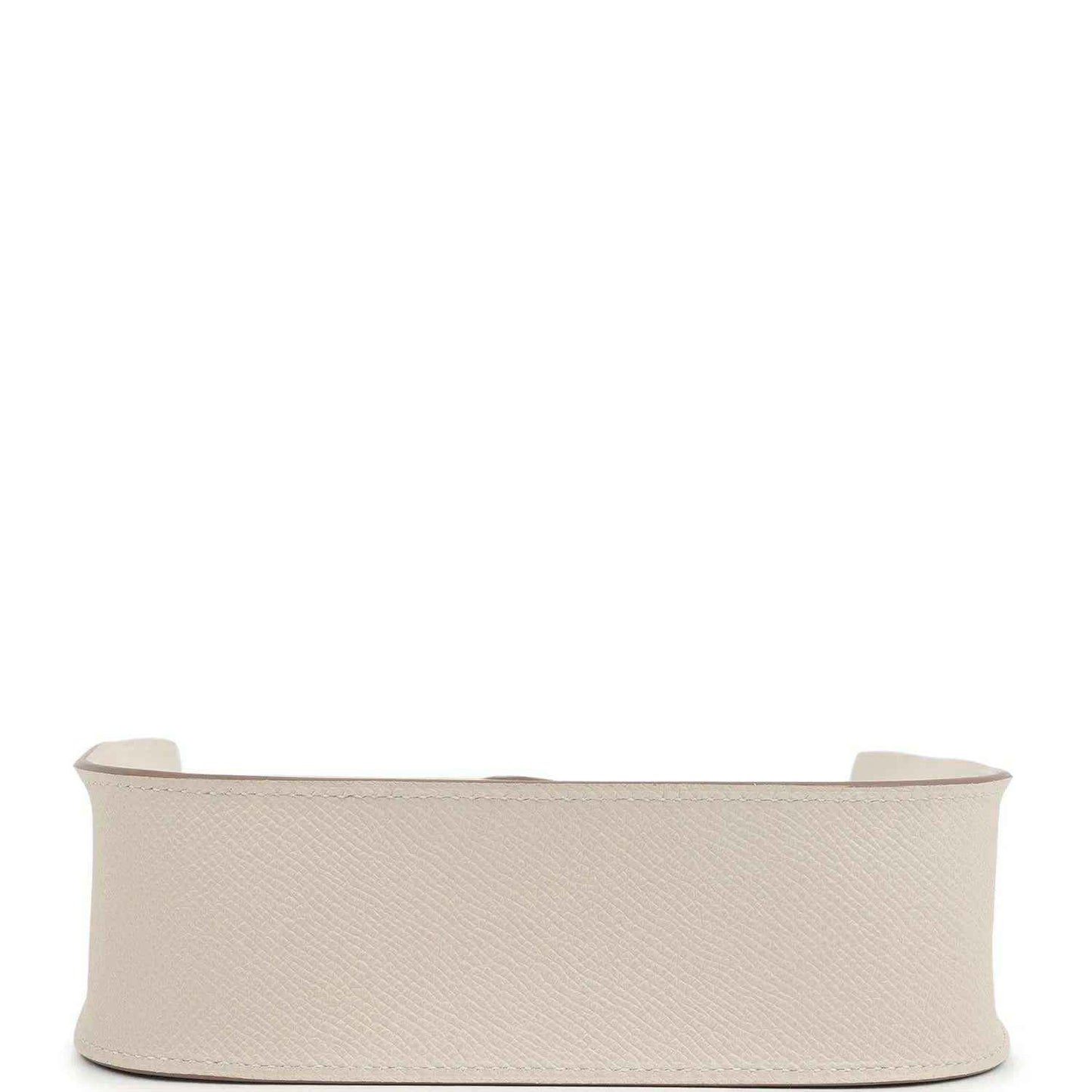 Light beige textured leather handbag profile with wide base and open top edge