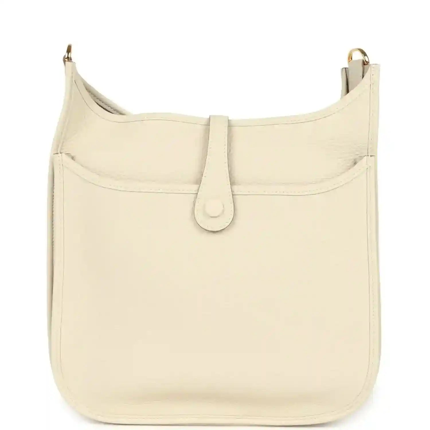 Cream leather shoulder bag with curved flap, stitched panel seams, and gold-tone top hardware.