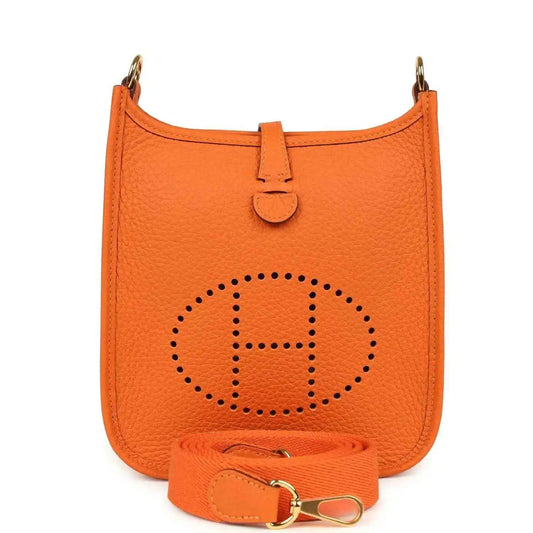 Orange Clemence leather crossbody bag with dotted Hermes logo and front strap tab