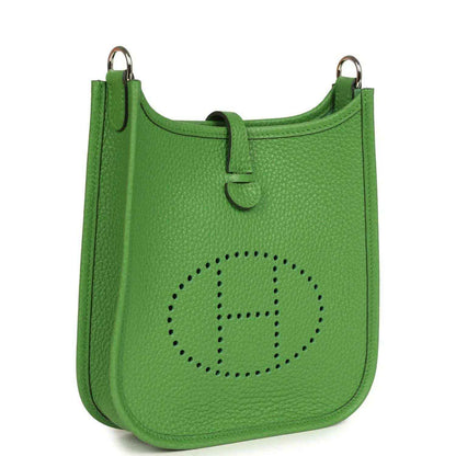 Green pebbled leather Evelyne TPM bag with perforated H logo and top loop handles