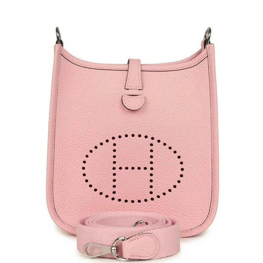 Rose pink leather Evelyne TPM bag with dotted logo and crossbody strap