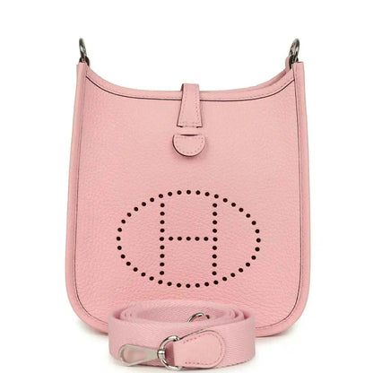 Rose pink leather Evelyne TPM bag with dotted logo and crossbody strap