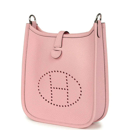 Rose pink leather Evelyne TPM bag with dotted logo and rounded front