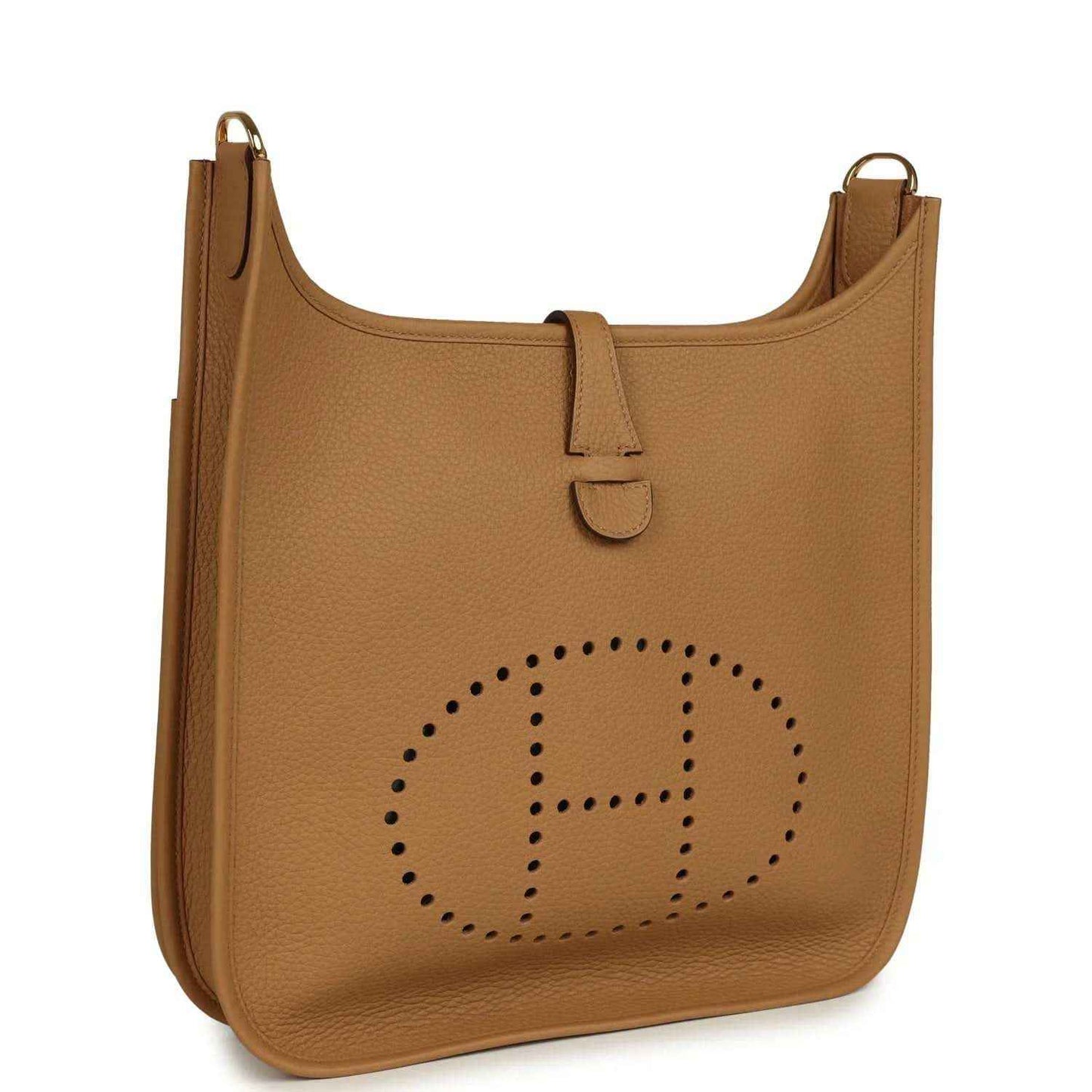 Tan leather hobo bag with front flap, perforated logo detail, and gold-tone hardware