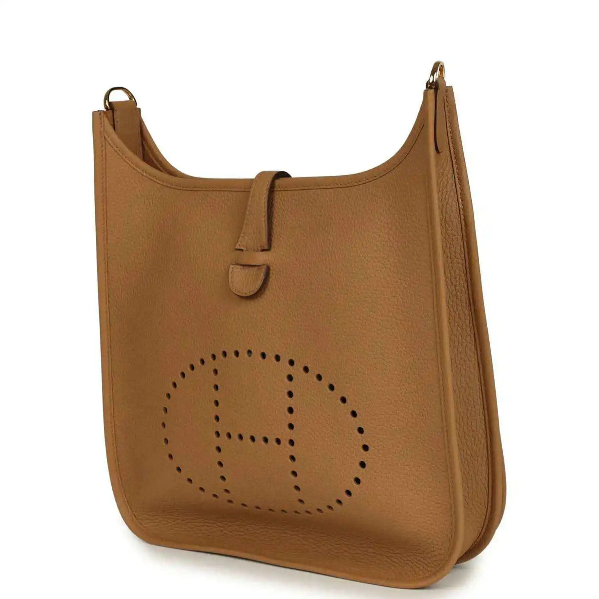 Tan leather hobo bag with perforated logo medallion and top handle strap