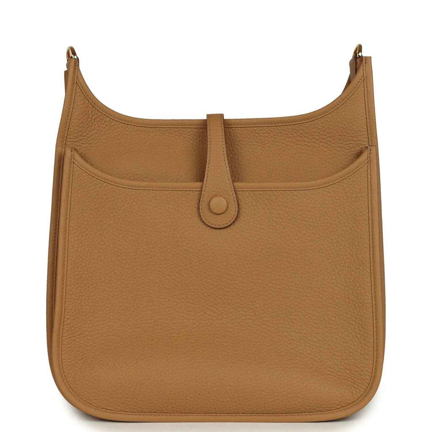 Tan leather hobo bag with front pocket, snap closure, and gold-tone hardware