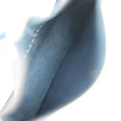 Blue leather bag interior lining close-up with seam and edge