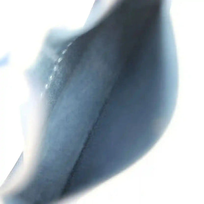 Blue leather bag interior lining close-up with seam and edge