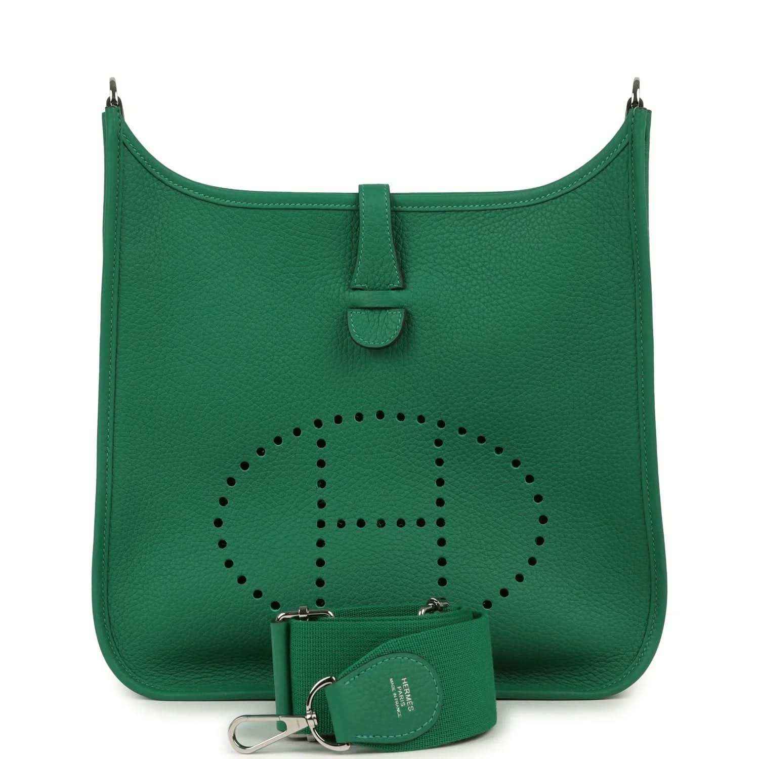 Green leather crossbody bag with perforated logo and small pouch with keyring