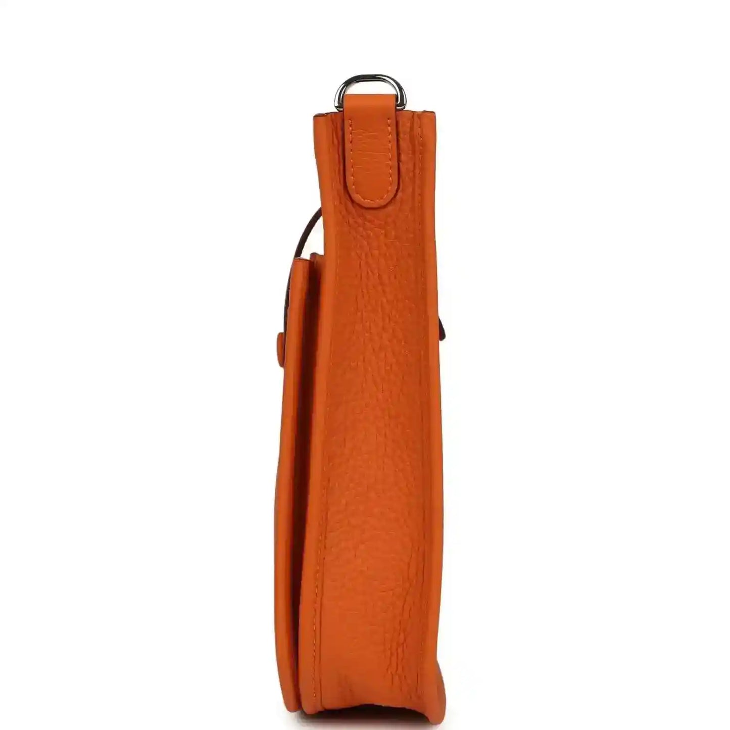 Orange leather hobo bag side view with top handle and slim structured shape