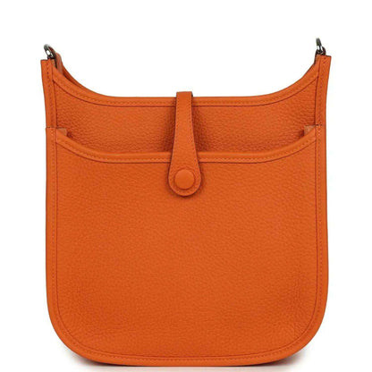 Orange leather hobo bag back view with top handle and center snap button