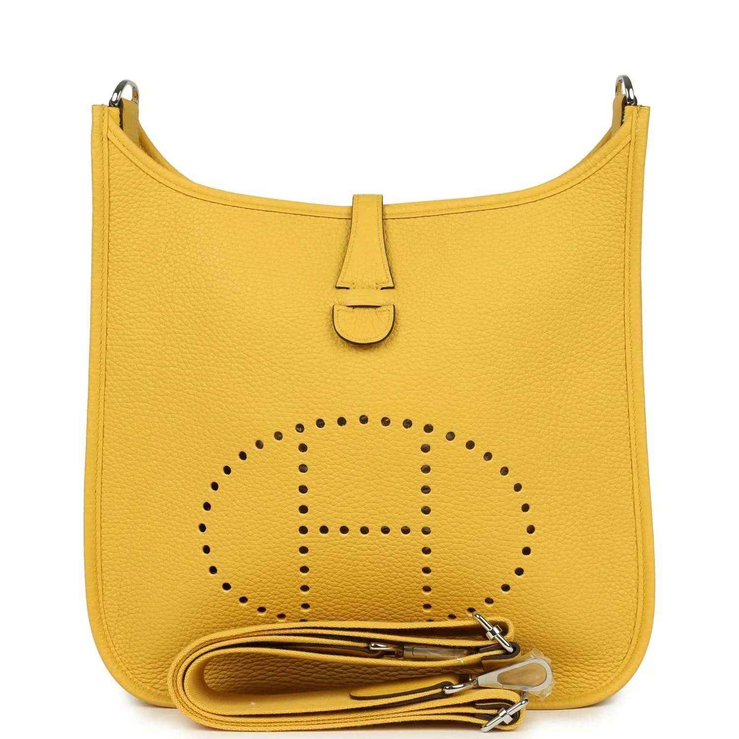 Yellow leather hobo shoulder bag with perforated emblem and top flap closure