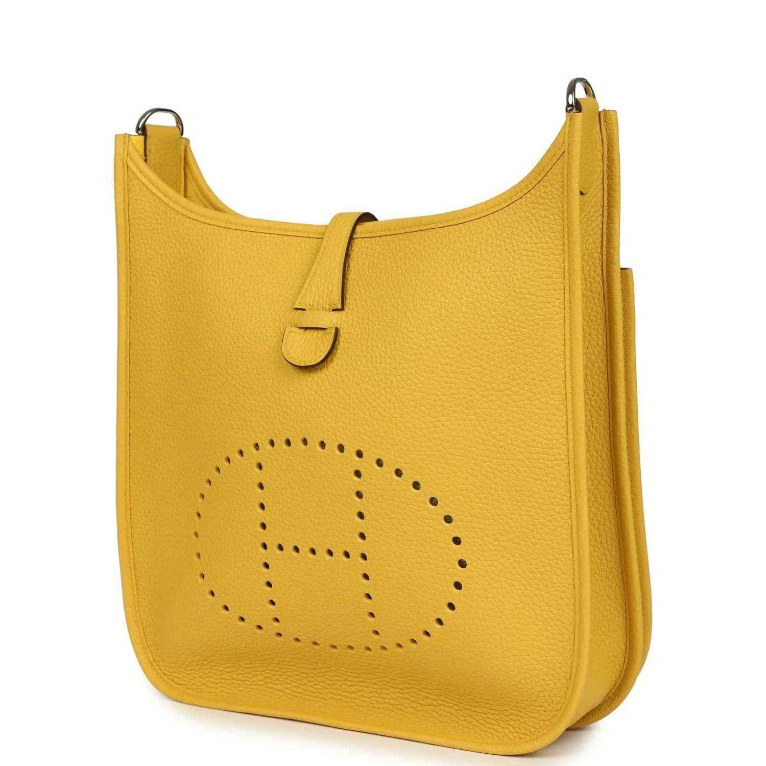 Yellow leather shoulder bag with perforated circular logo on front panel