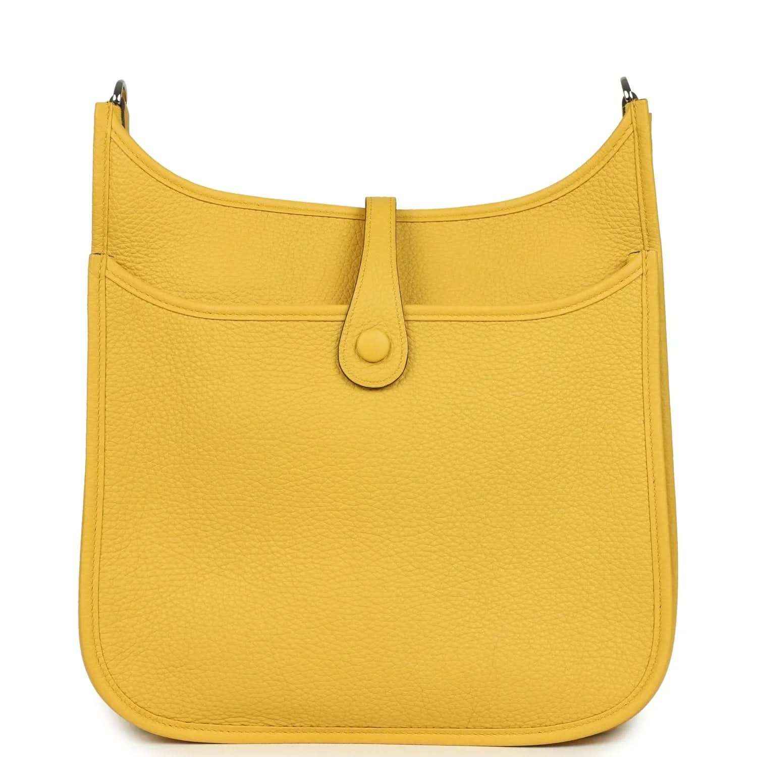 Yellow leather hobo bag with curved top, front flap, and central tab closure